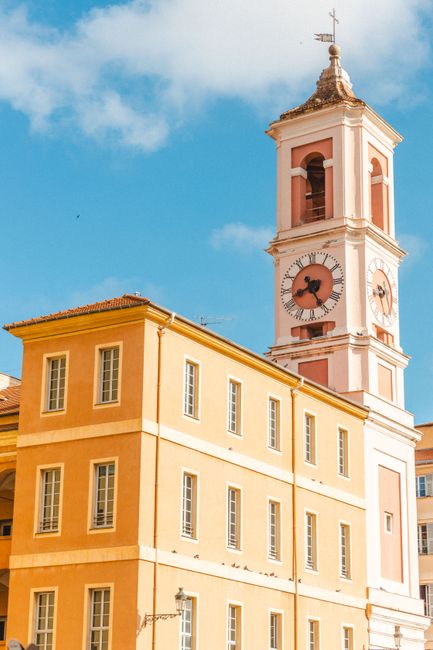 Beautiful view of the historic clock tower in Nice, Provence, under a clear blue sky.