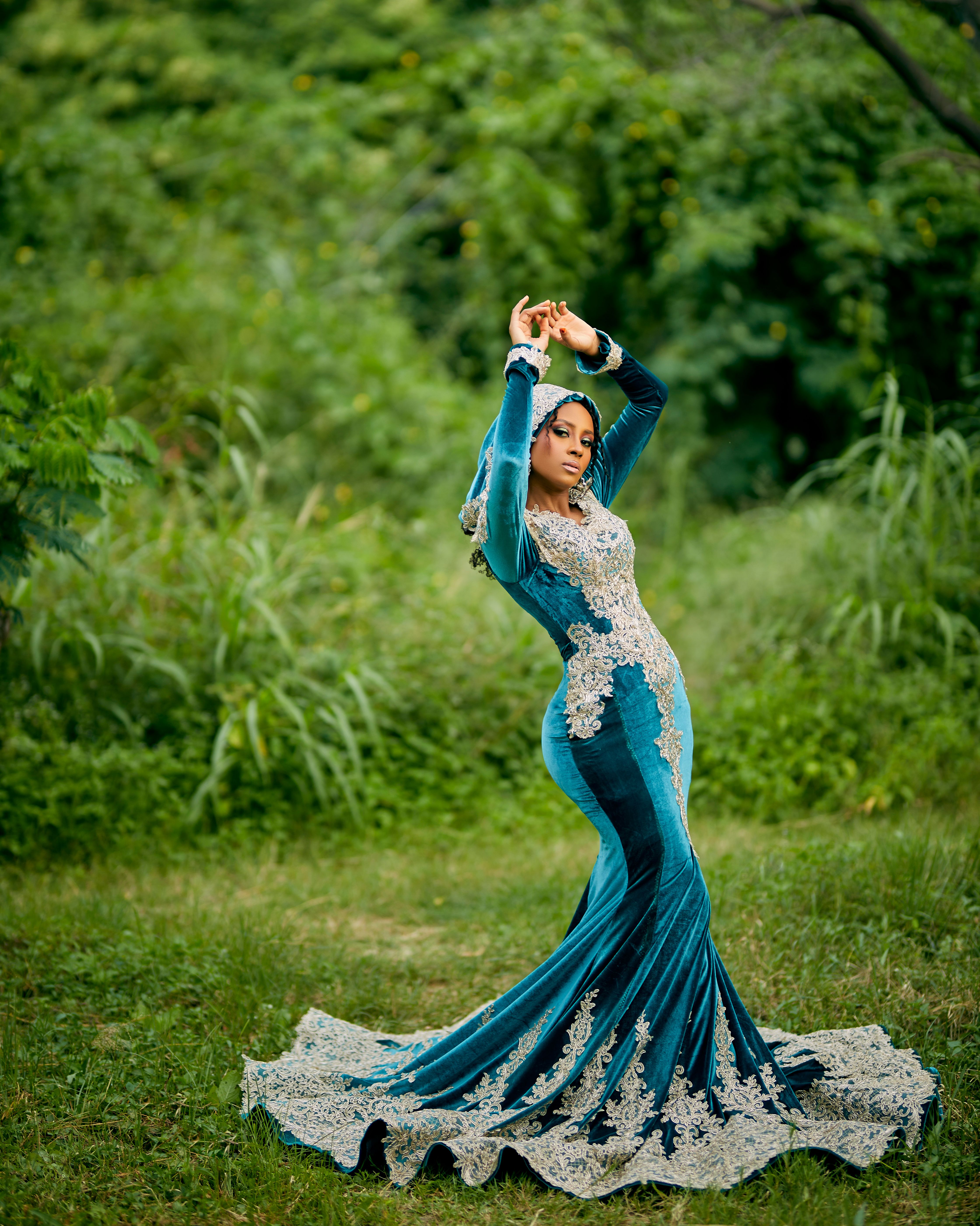 Elegant Woman in Blue Dress Amidst Nature · Free Stock Photo