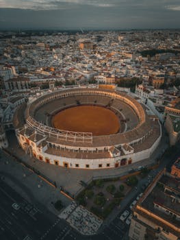 Stunning aerial capture of Plaza de Toros in Seville, showcasing the iconic architecture and cityscape.
