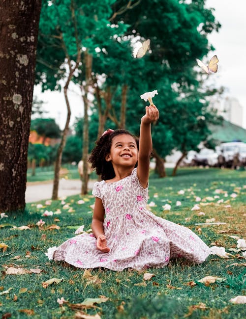 Girl Sitting On Grass