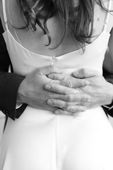 Artistic black and white close-up of a couple embracing, showcasing intimacy and connection.