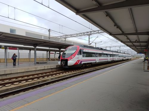 Free Cercanías train arriving at El Puerto de Santa María station in Spain. Stock Photo
