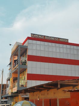 A modern business building in Bujumbura, Burundi with striking red accents.
