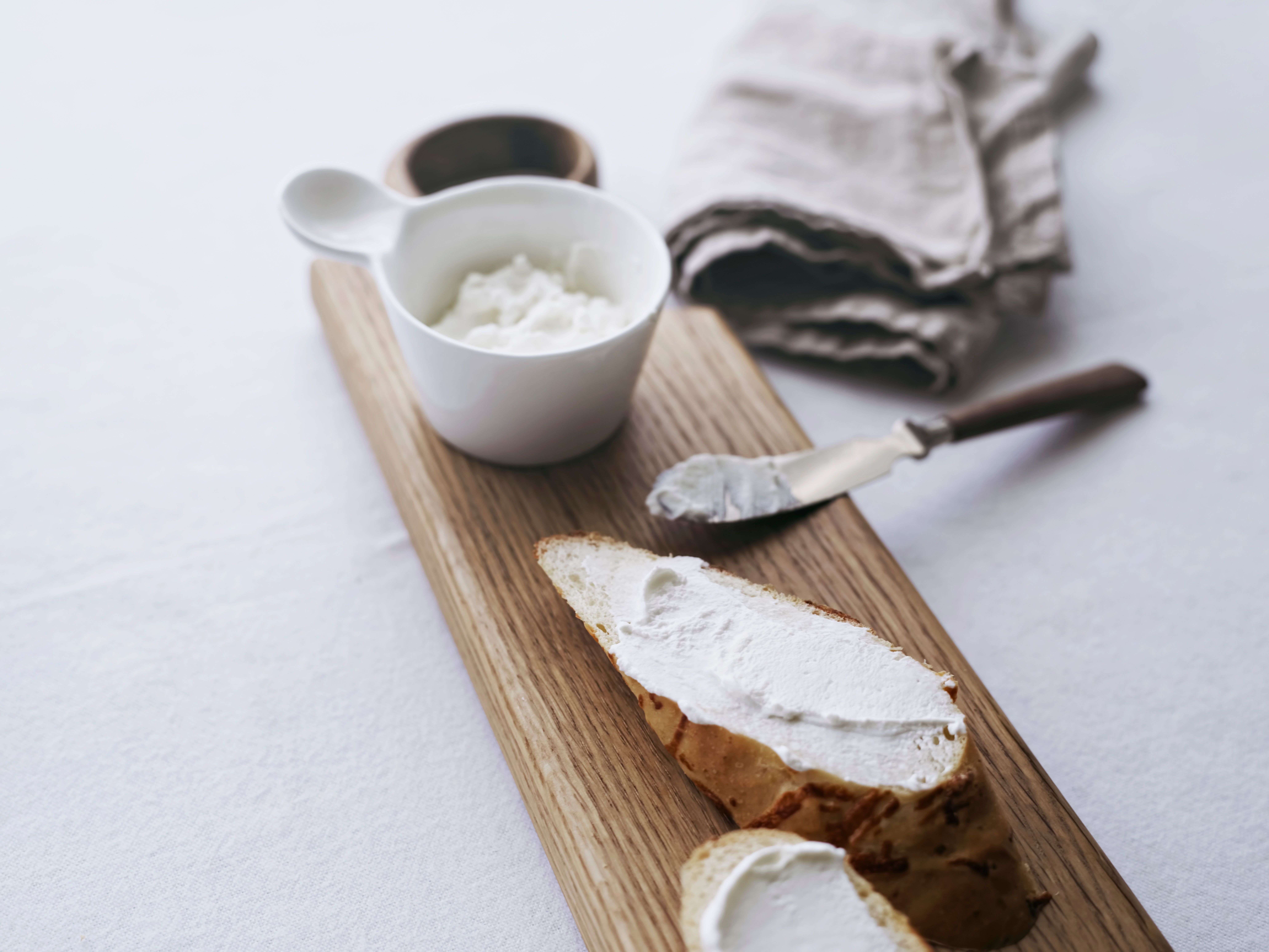 Oak serving board with bread and butter knife