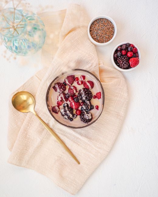 A delicious yogurt bowl topped with fresh berries and seeds, perfect for a healthy breakfast.