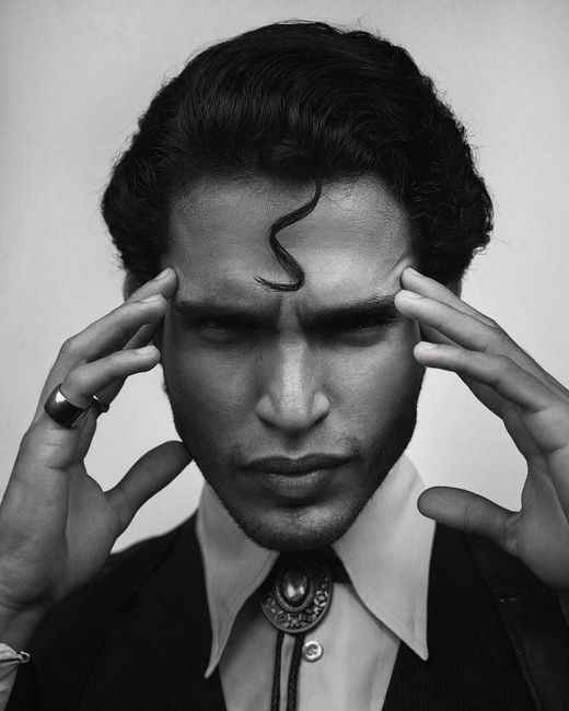A striking black and white portrait capturing a man's intense expression.
