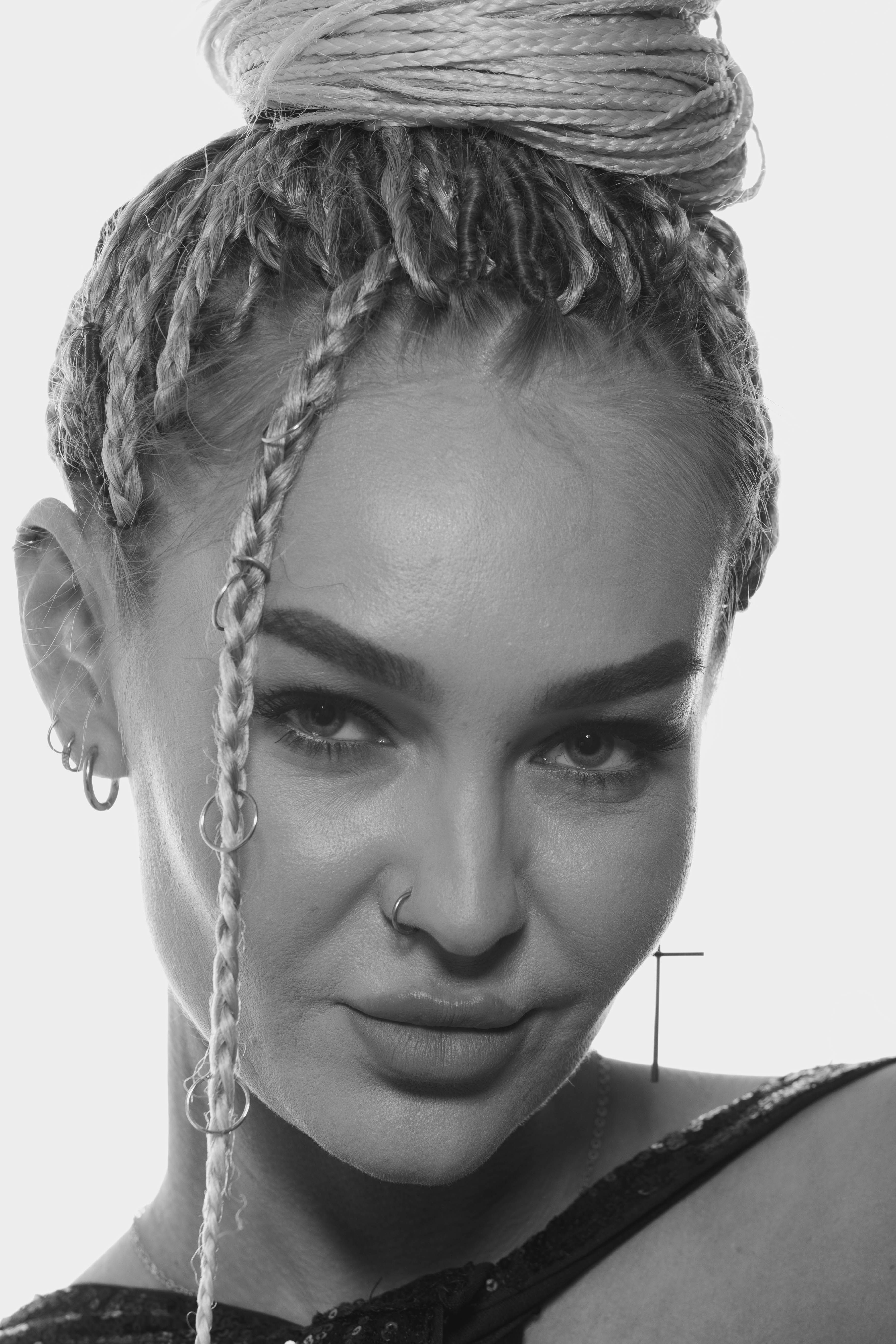 Elegant Portrait of Woman with Braided Hair · Free Stock Photo