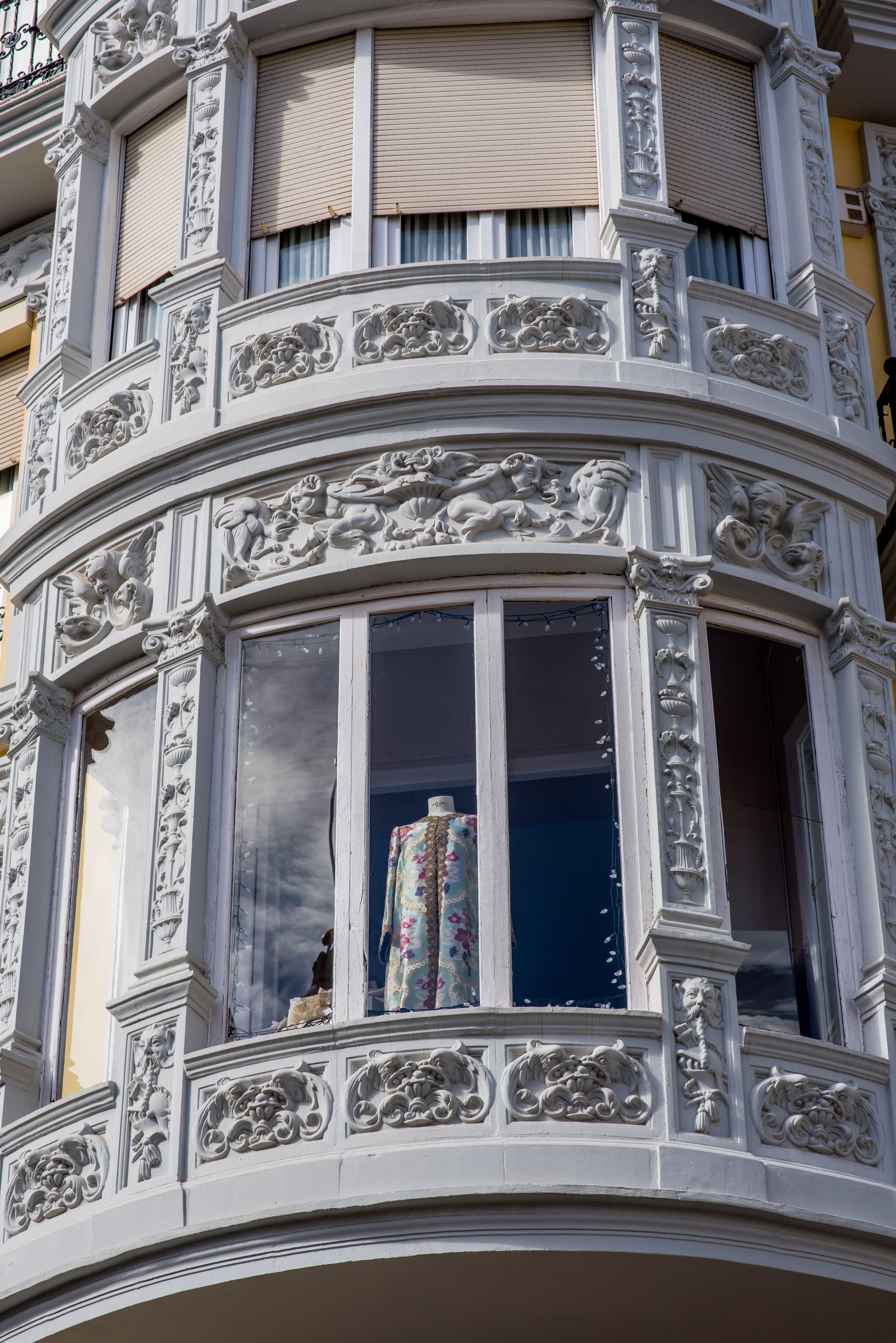 Ornate Architectural Facade with Display Window · Free Stock Photo