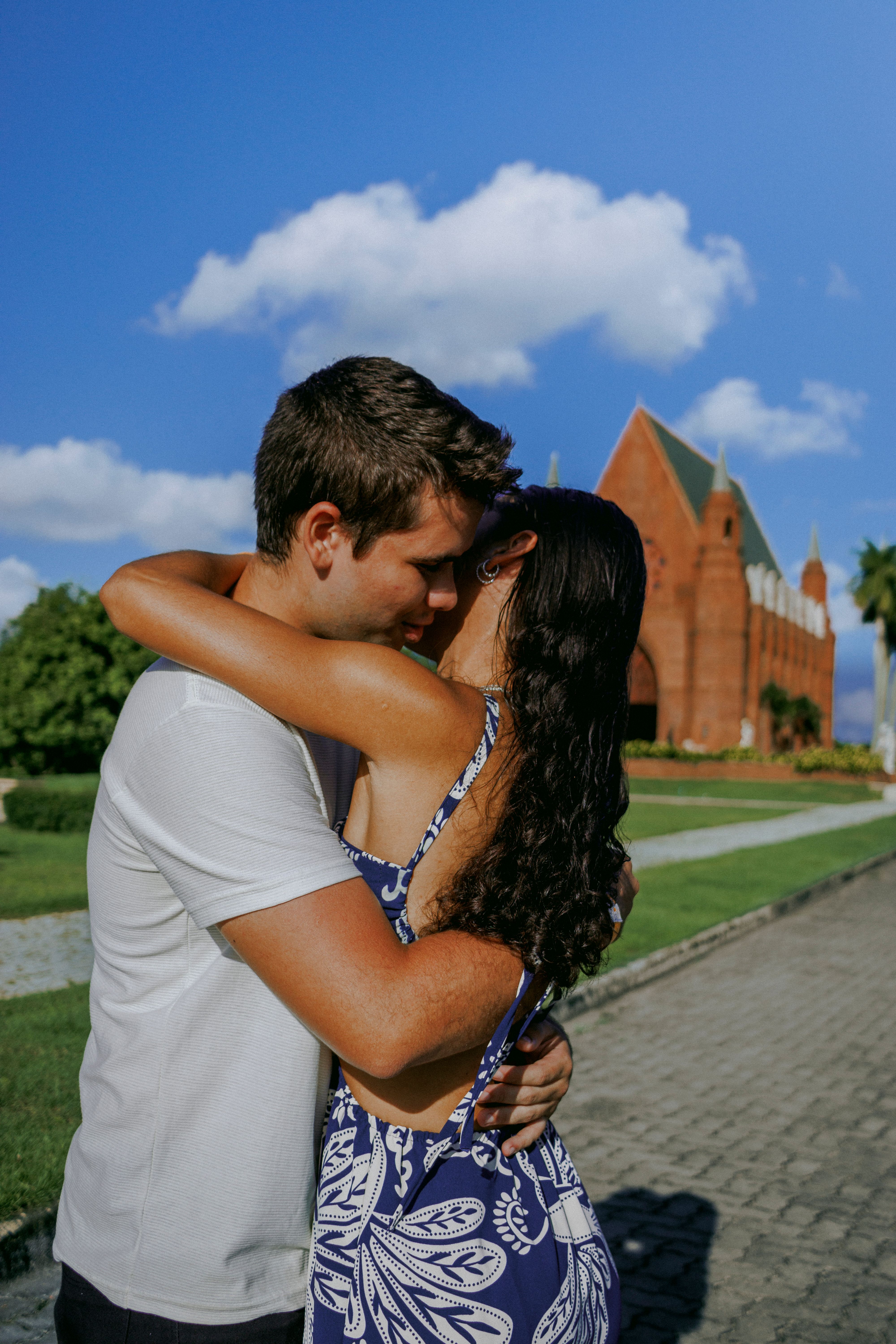 Romantic Couple Sharing a Kiss Outdoors · Free Stock Photo