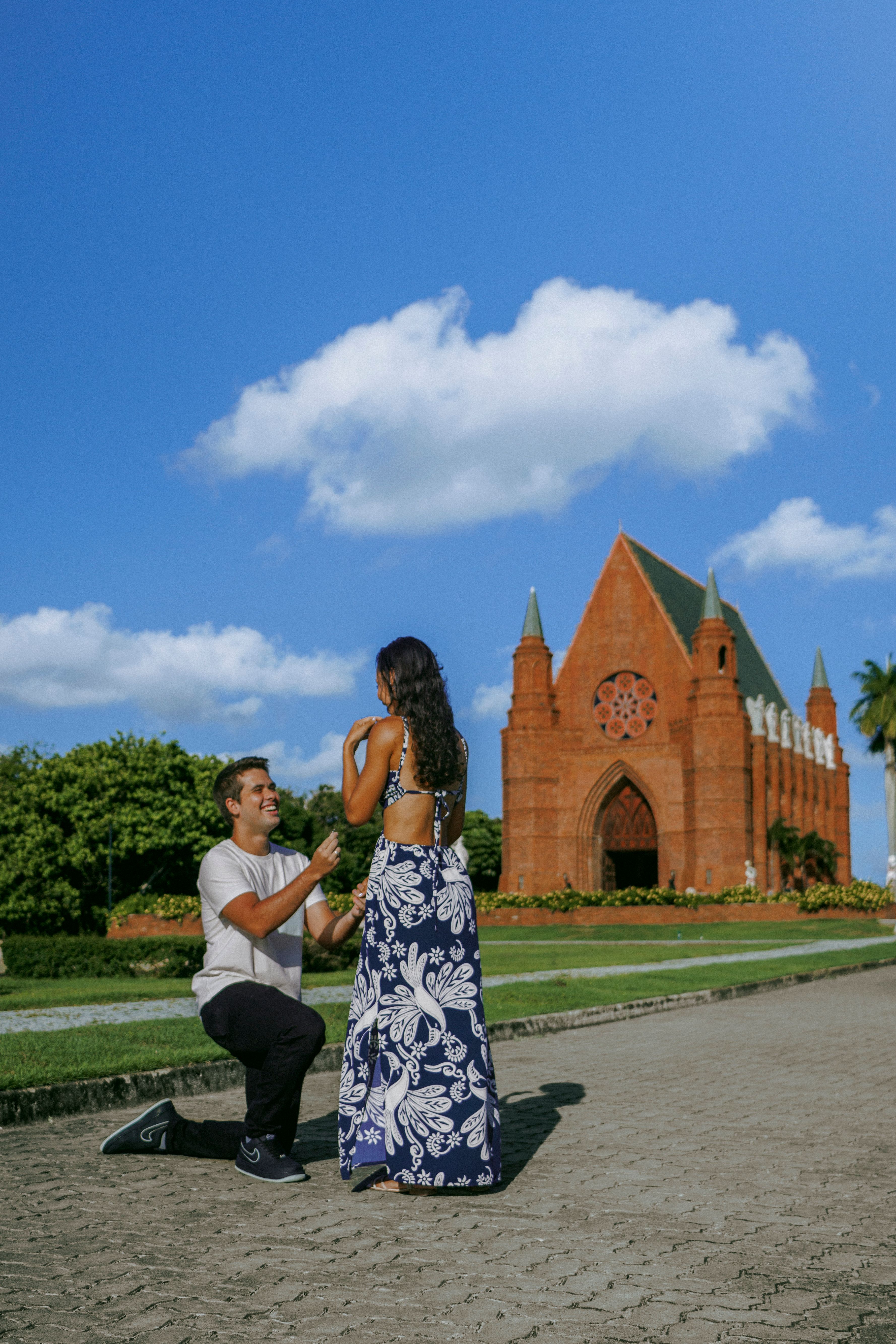 Romantic Proposal in Front of Gothic Chapel · Free Stock Photo