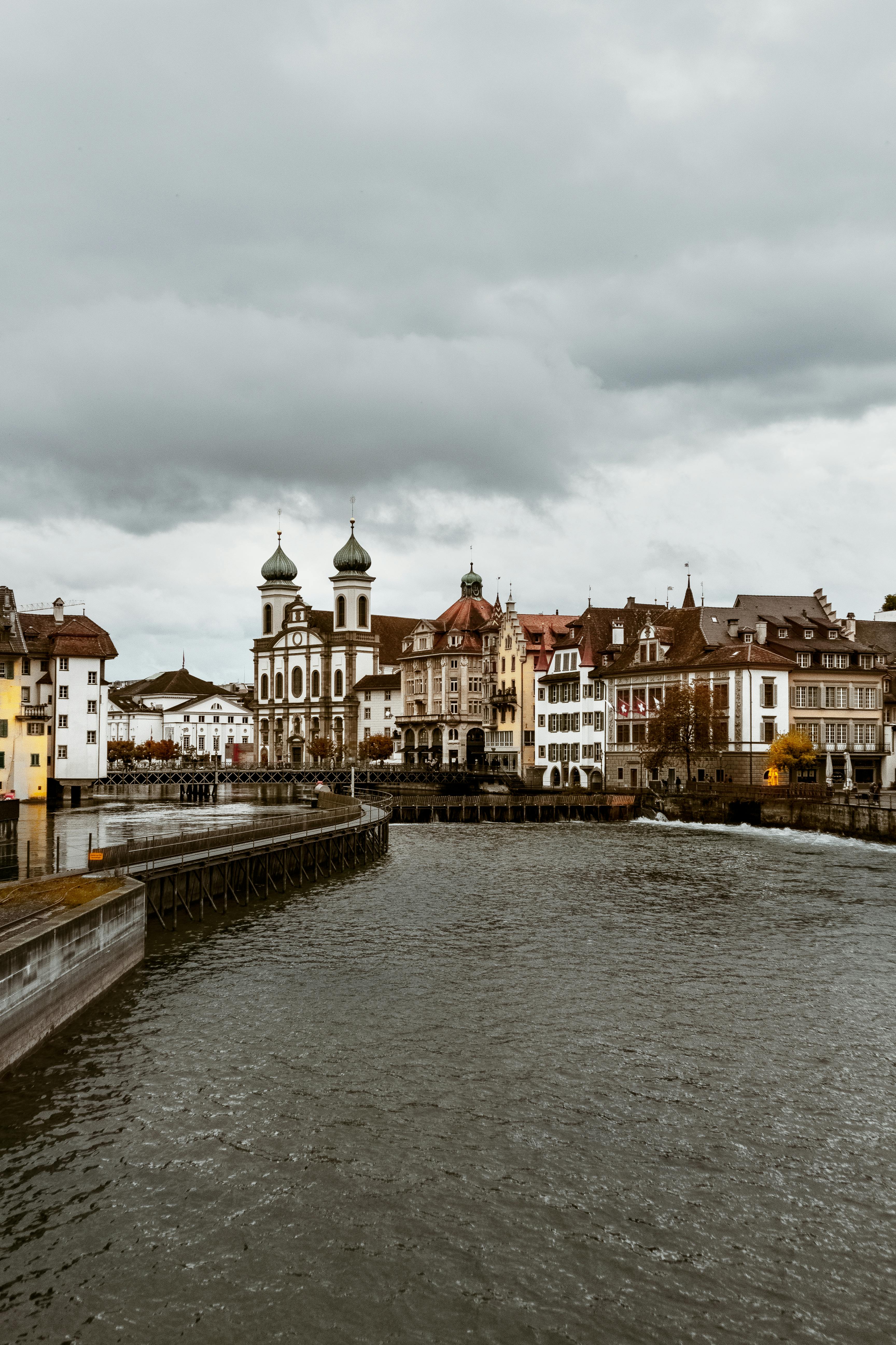 white and brown concrete buildings under cloudy sky