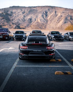 A lineup of luxury cars parked against a mountainous background in Ankara, Türkiye.
