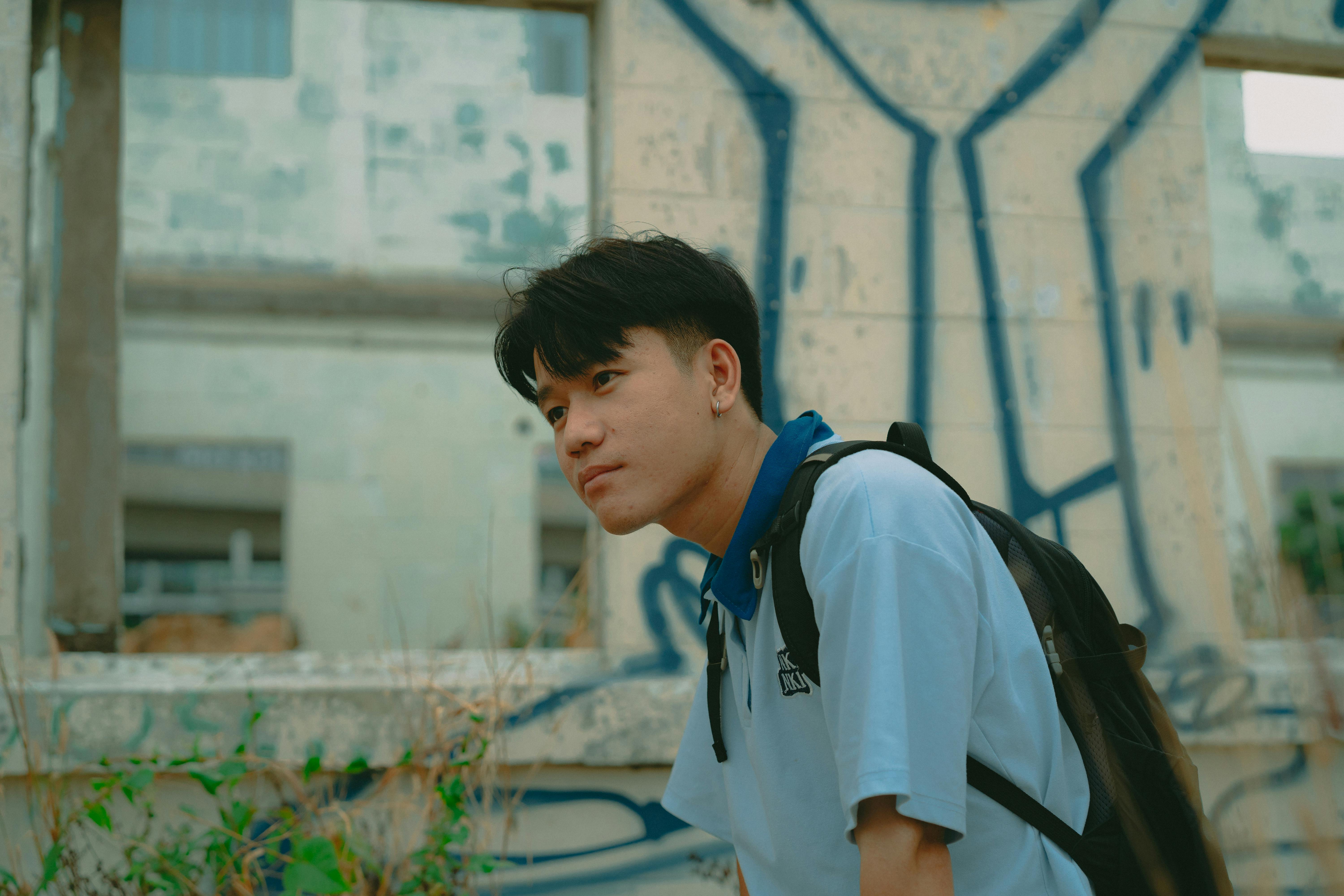 young man in urban setting with graffiti