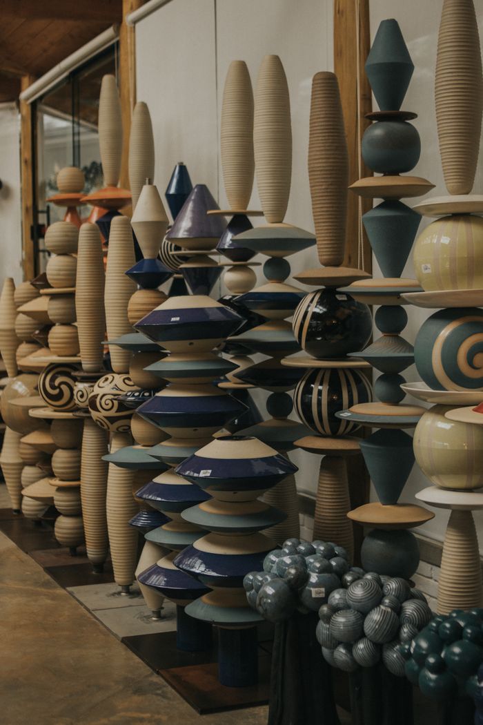 Stacked ceramic forms in a gallery — photo by juliane Monari on Pexels