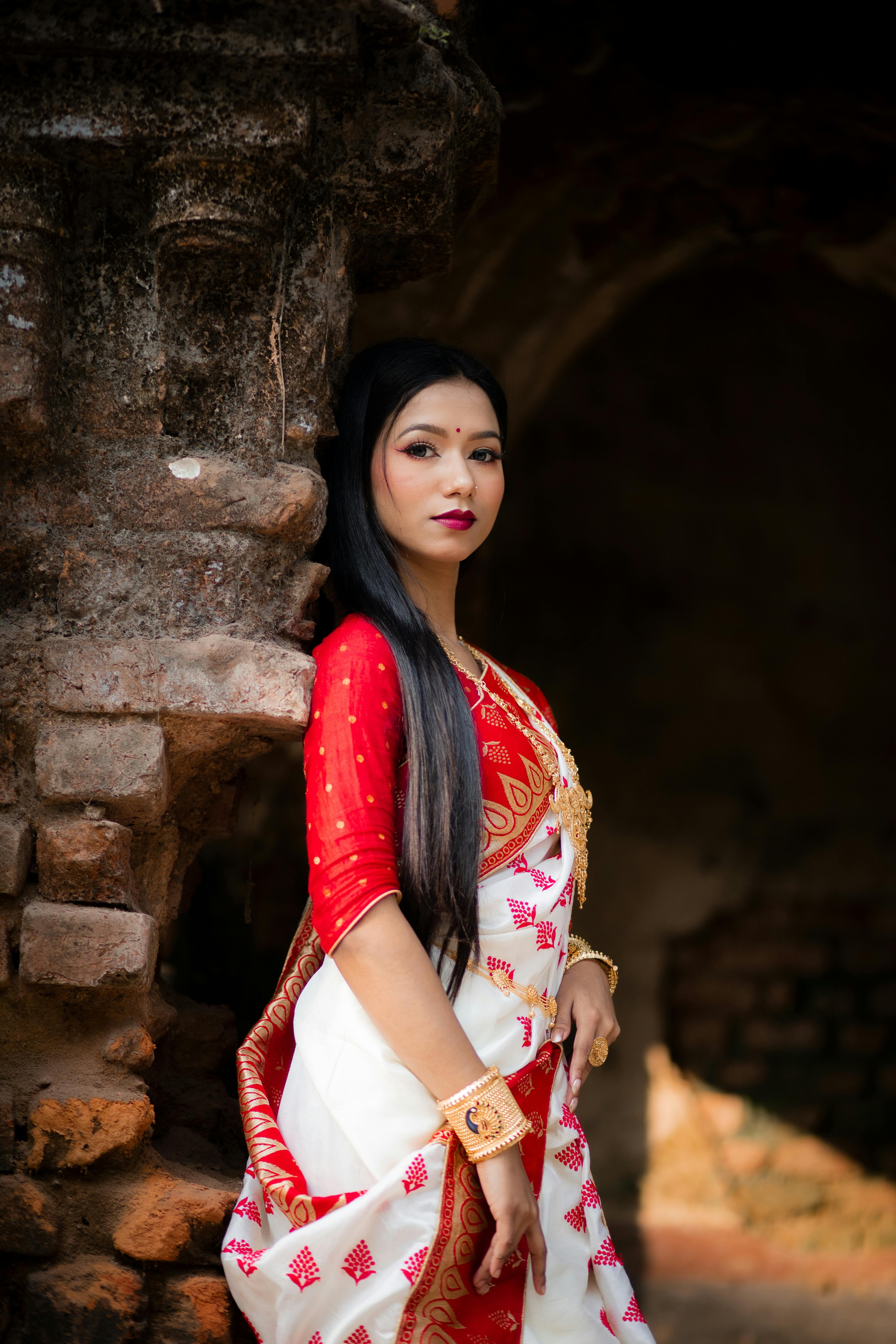 elegant woman in traditional sharee at ancient ruins