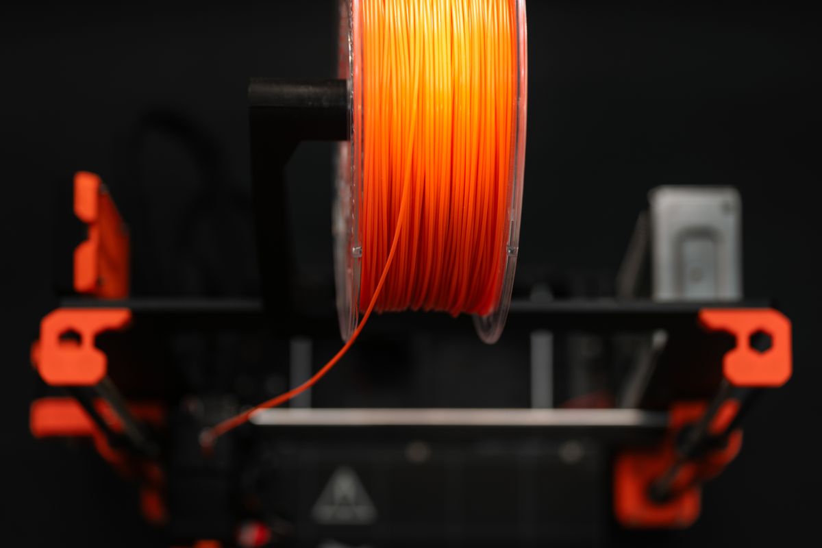 Orange 3D printing filament spool close-up
