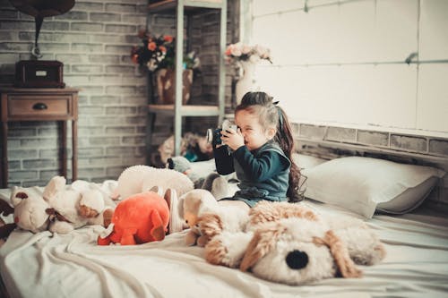 Photo of Girl Using Camera