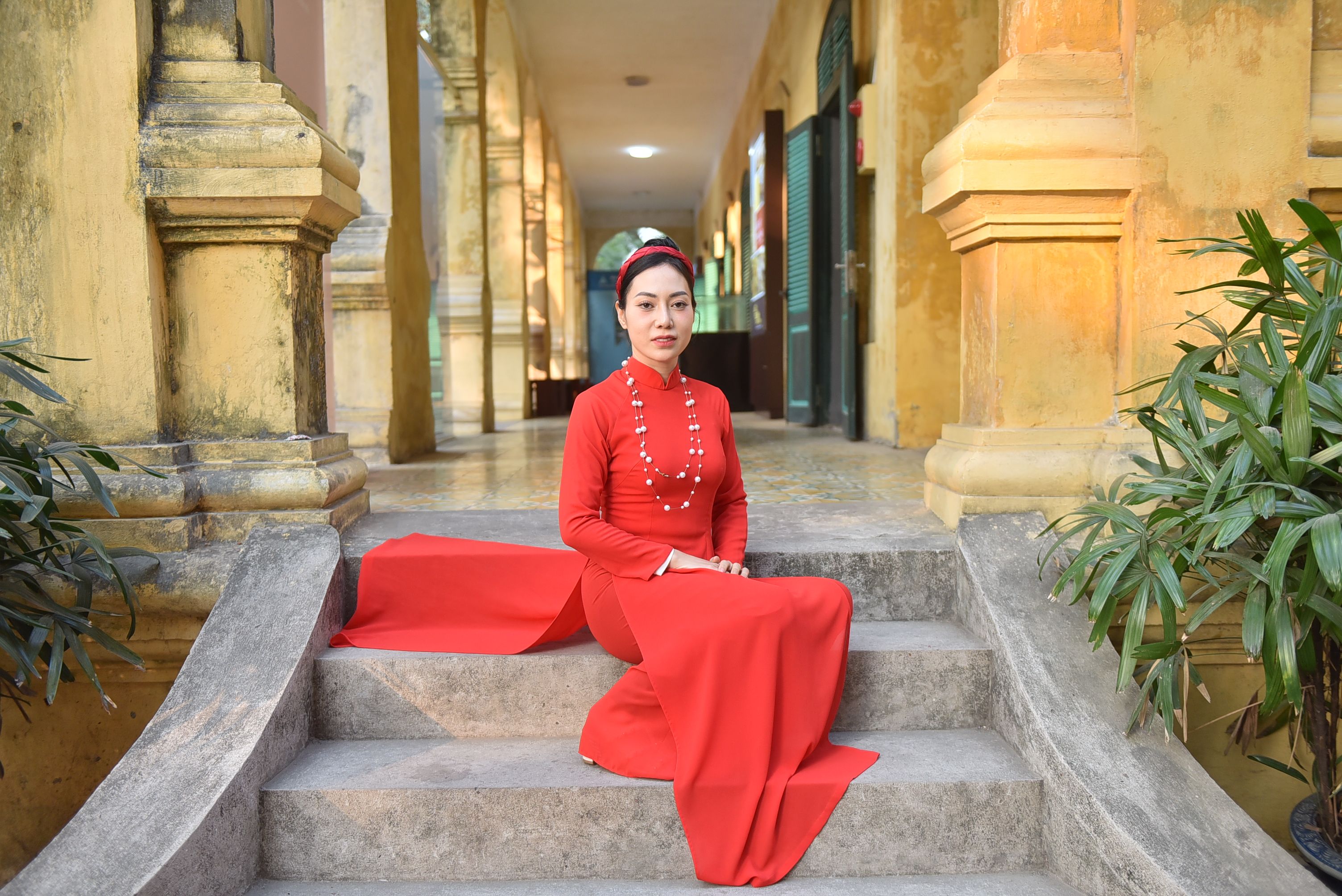 Elegant Woman in Red Dress Sitting on Steps · Free Stock Photo