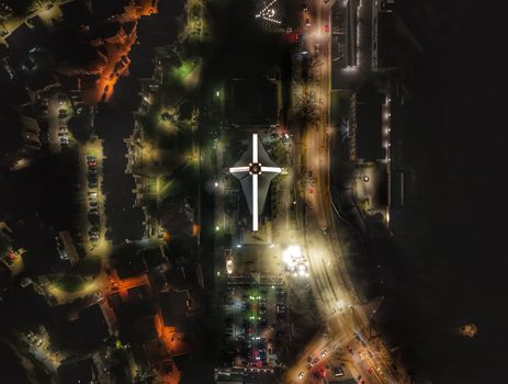 Stunning aerial nighttime view of a church in Mostar, Bosnia and Herzegovina, showcasing architectural beauty.