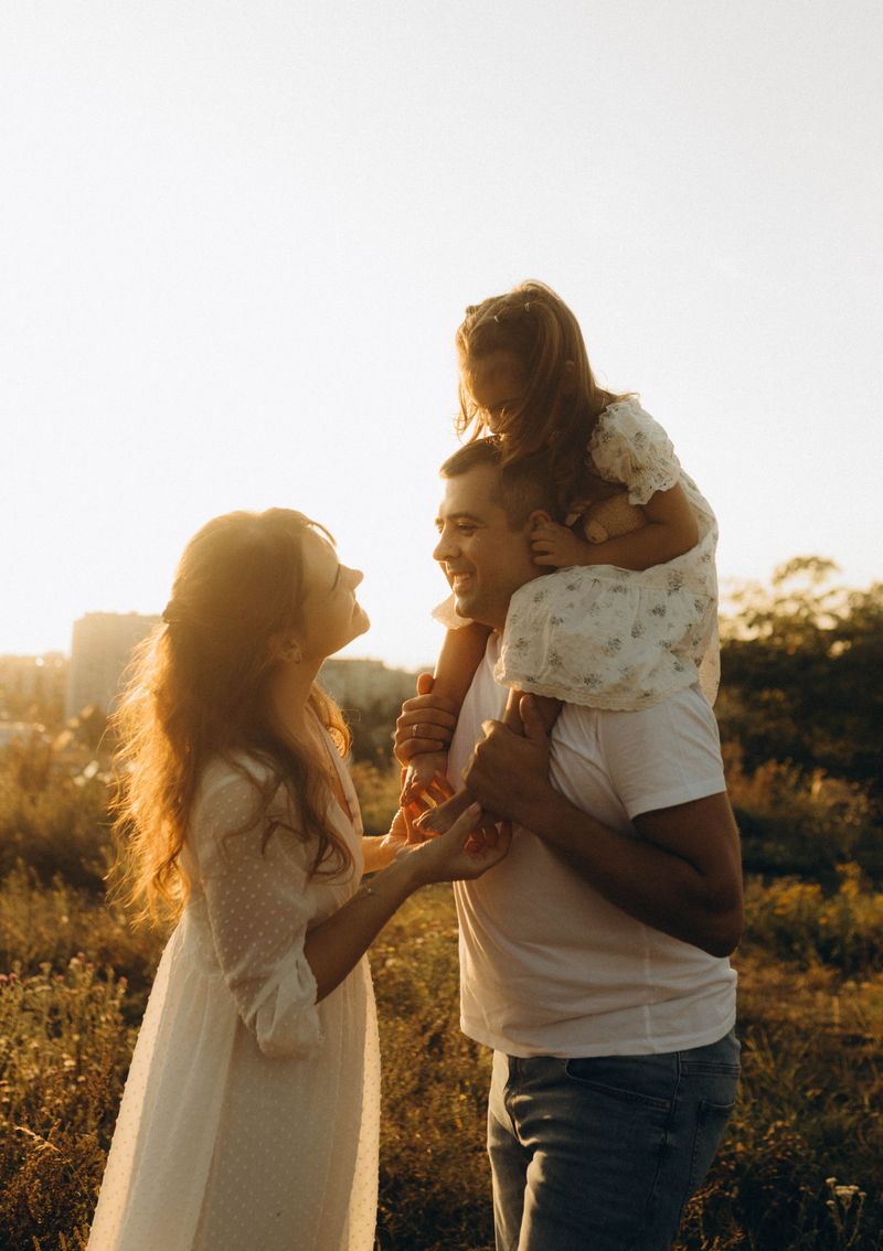 Joyful homeschool family moment in golden hour sunset
