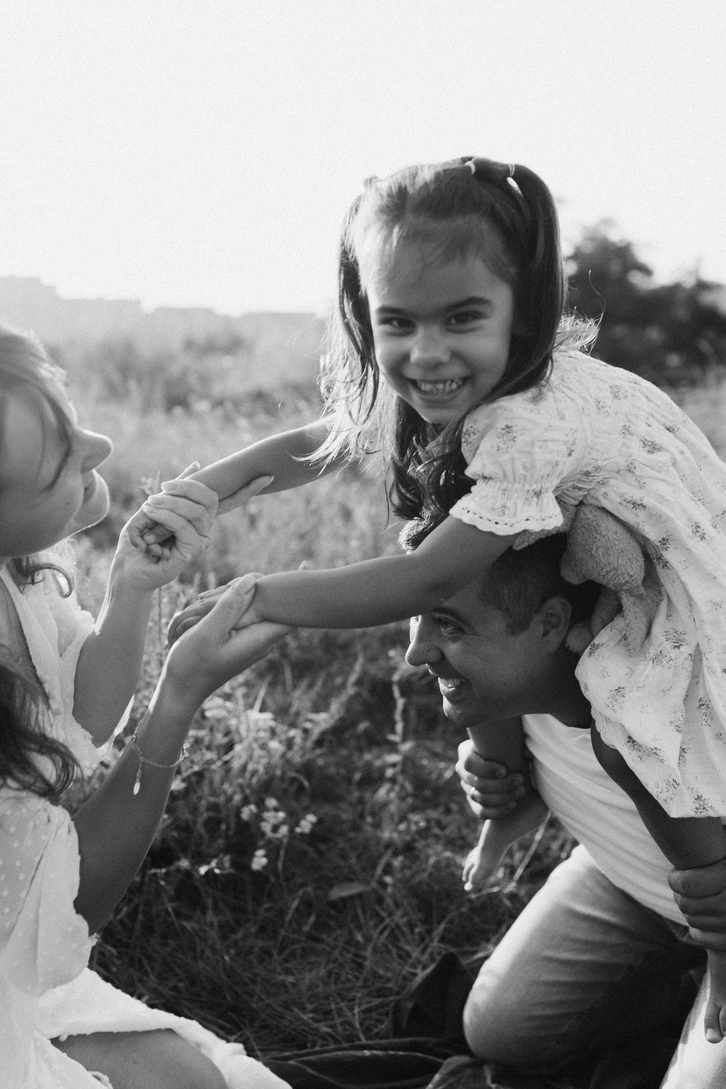 Joyful Family Bonding in Outdoor Setting · Free Stock Photo