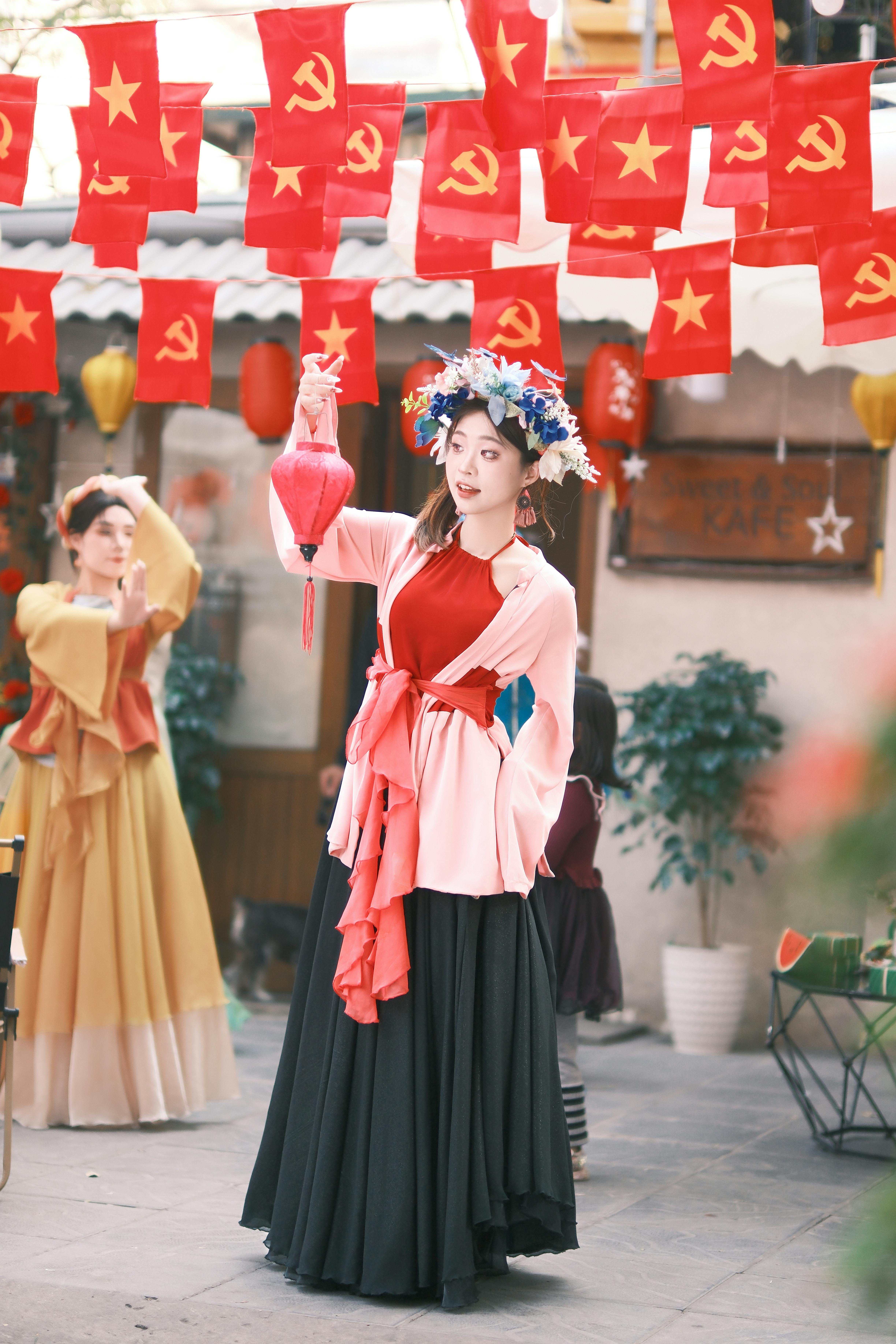 traditional festival celebration with flags and costumes