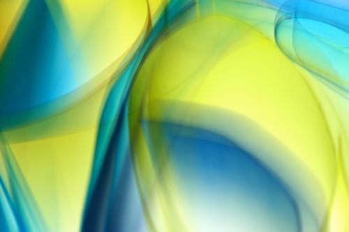 Free Colorful abstract patterns with yellow and blue hues create a vibrant flow of energy. Stock Photo