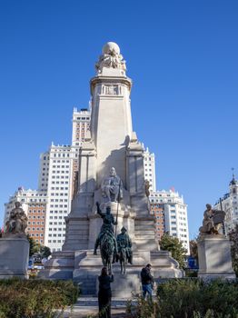Iconic Cervantes Monument located in Plaza de España, Madrid, Spain, against a clear blue sky.