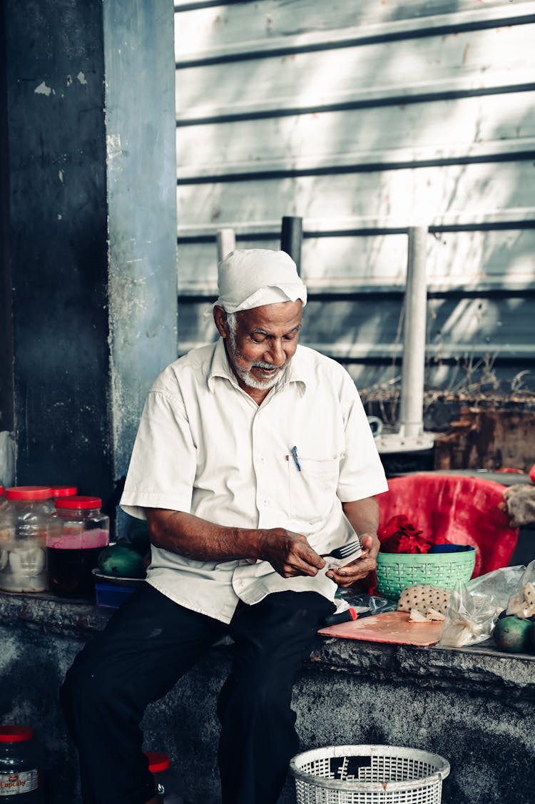 Portrait Of An Elderly Vendor In Kochi, India