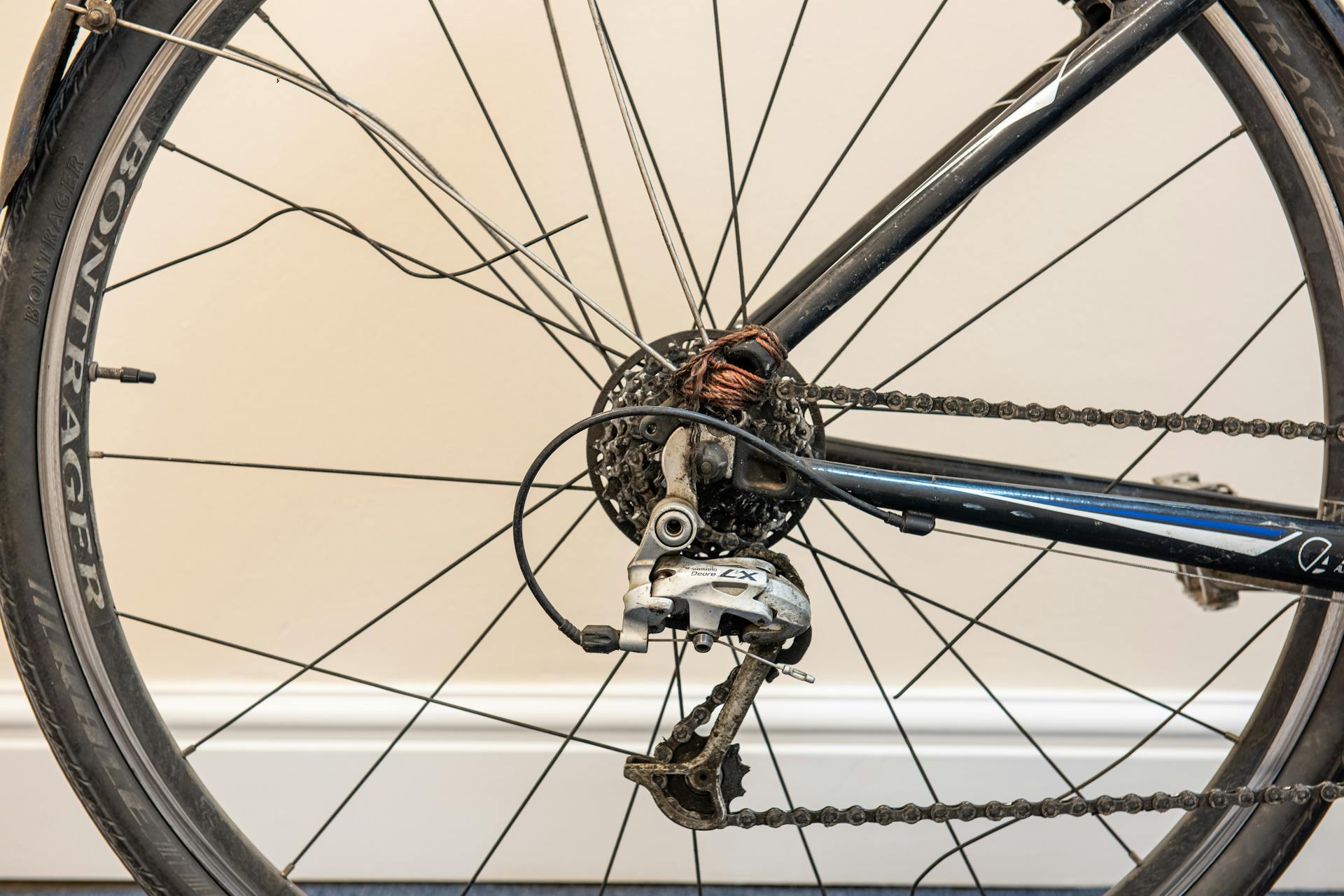 Close-up of a broken bicycle wheel and damaged spokes in London.