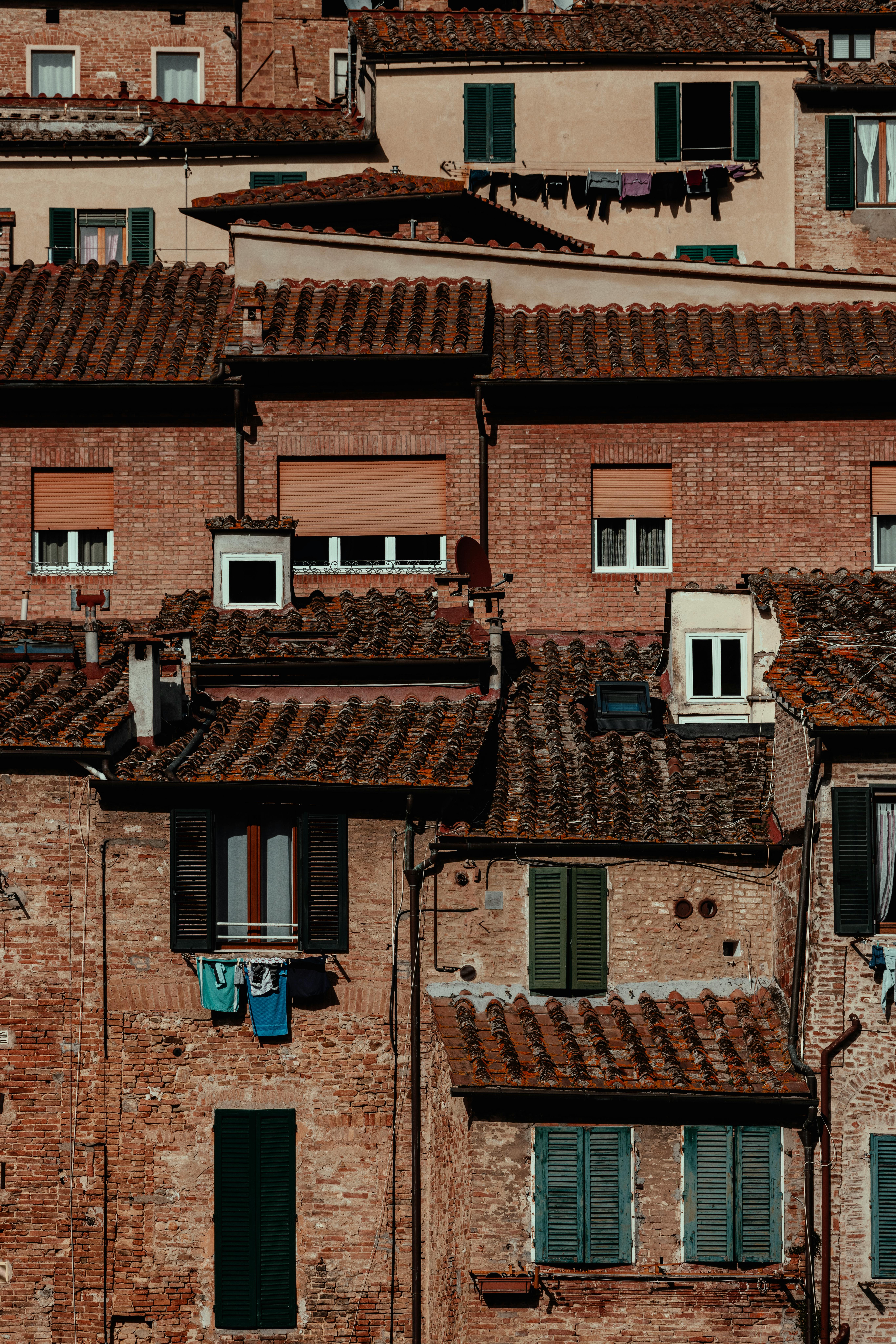 Charming Tuscan buildings with terracotta roofs capture the essence of Italian architecture.