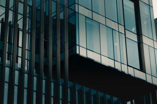 Close-up view of modern glass building architecture in Edinburgh, Scotland.