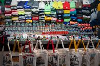 Colorful display of New York souvenirs including hats, bags, and trinkets.