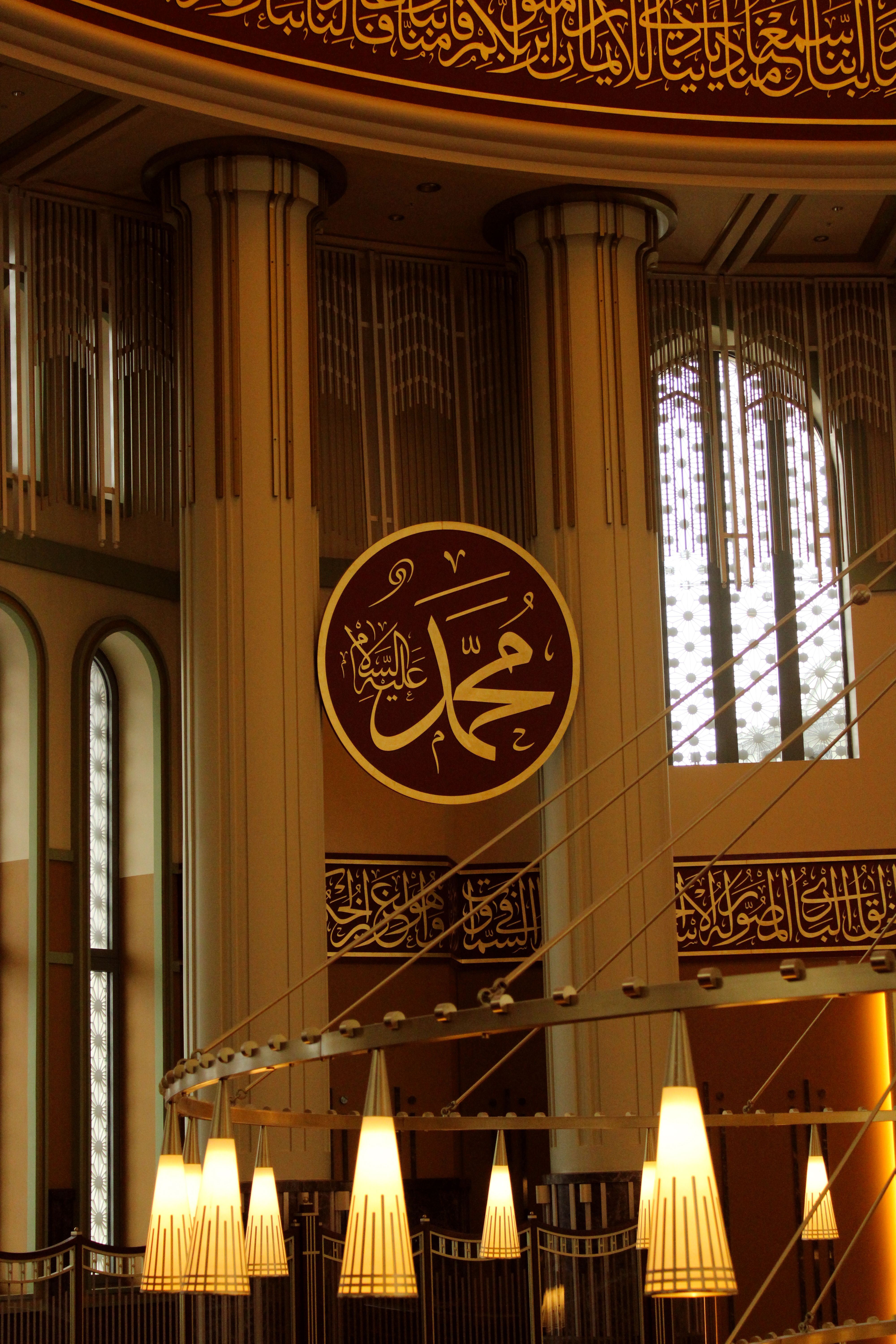 Interior of Mosque with Arabic Calligraphy and Chandeliers · Free Stock ...