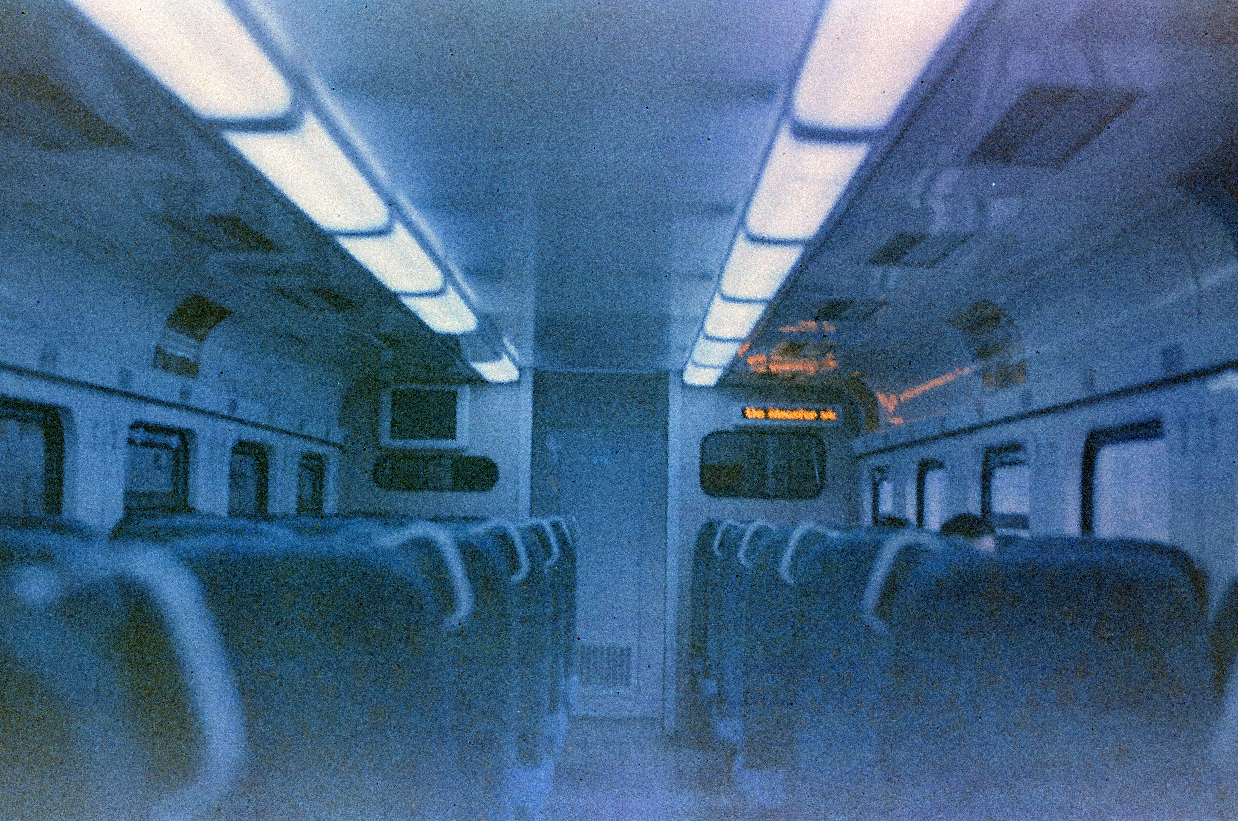 Moody vintage-style photo inside an empty night train in Tehran, Iran.