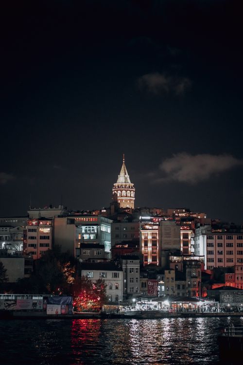 Free Majestic Galata Tower overlooking Istanbul skyline at night. Stock Photo