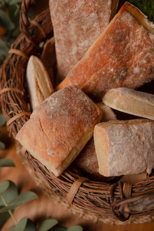 Free Freshly baked artisanal bread in a wicker basket, showcasing rustic charm and homemade quality. Stock Photo