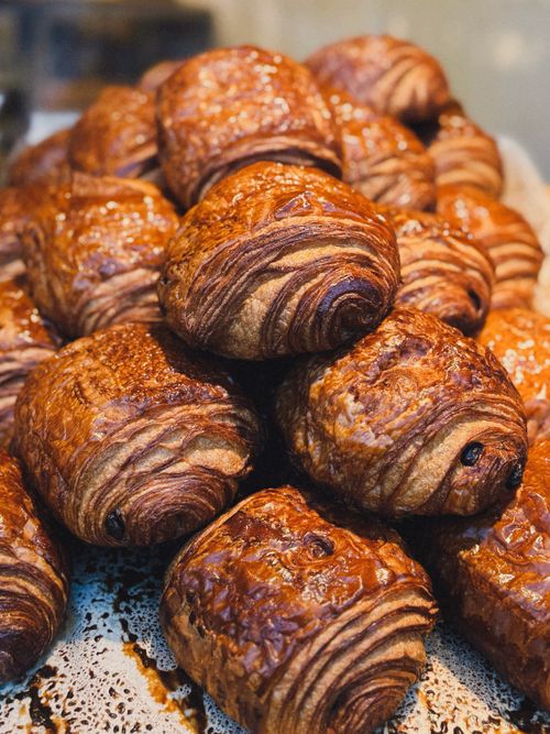 Free Pile of golden, flaky pain au chocolat pastries freshly baked. Stock Photo