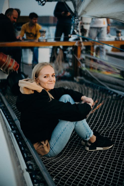 Woman Sitting on Metal Net