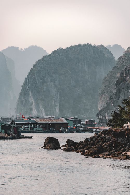 Free Beautiful limestone karsts and fishing boats in Halong Bay, Vietnam at daytime. Stock Photo