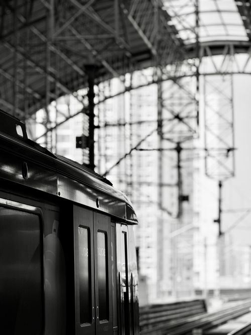 Free A sleek train at a contemporary station, captured in black and white. Stock Photo