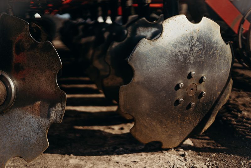 Detailed view of metallic plow discs showcasing texture and design