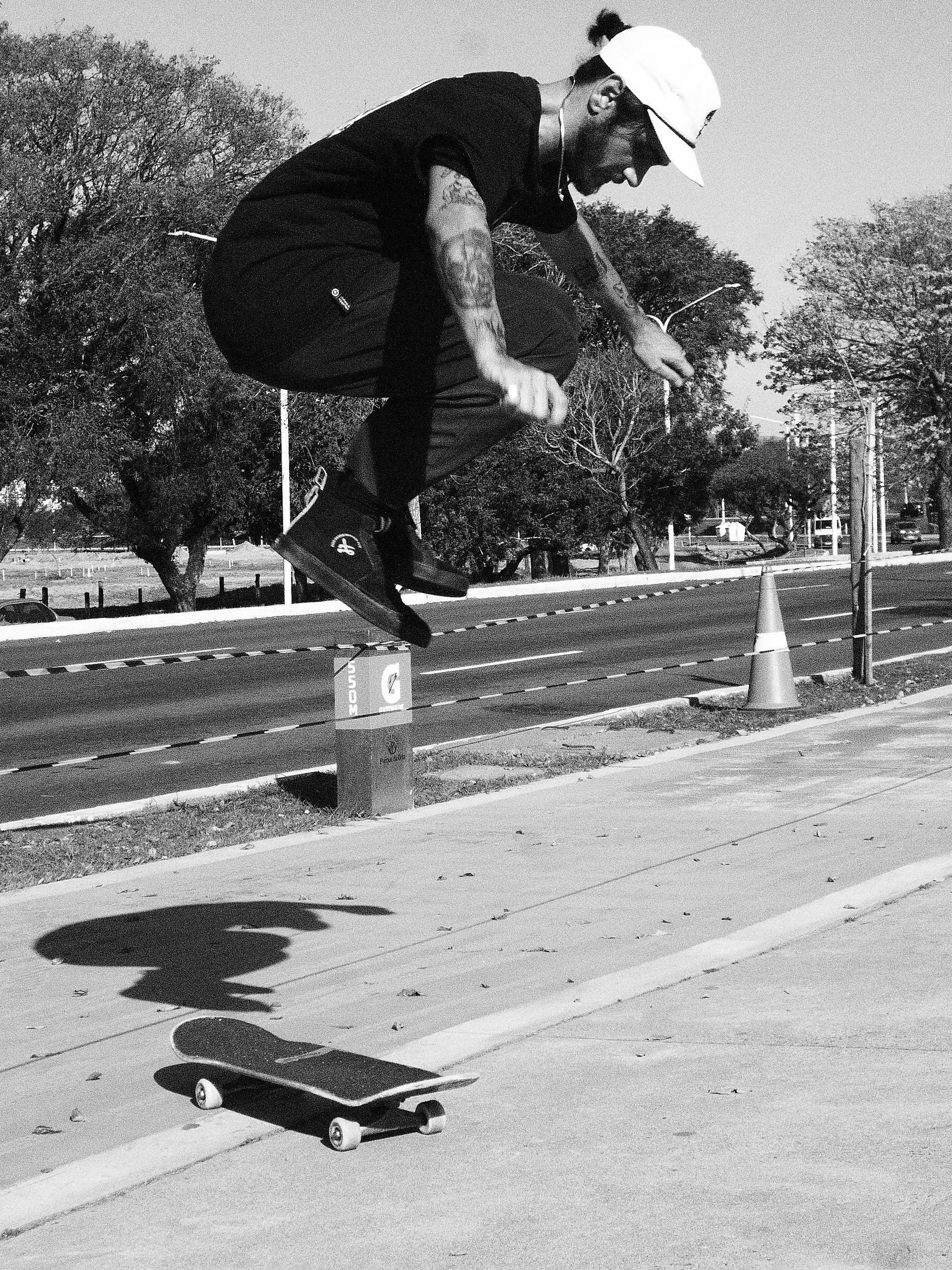 Skateboarder Performing Jump Trick at Urban Park · Free Stock Photo