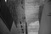 Window Cleaner Ascending Skyscraper in City