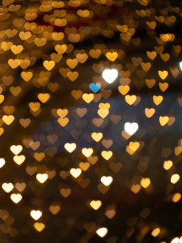 Warm and romantic heart-shaped bokeh lights creating an intimate ambiance.
