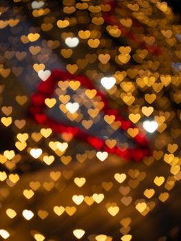Romantic heart bokeh lights creating a warm, festive atmosphere.