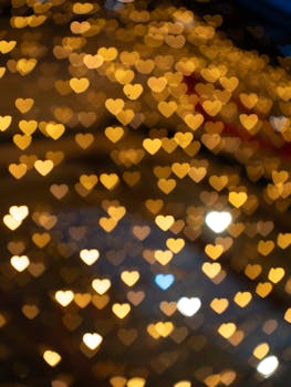Romantic heart-shaped bokeh lights creating a warm, festive atmosphere, perfect for celebrations.