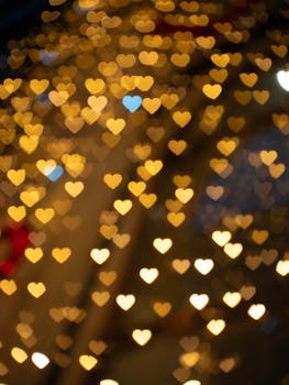Warm, heart-shaped bokeh lights create a romantic and festive atmosphere.