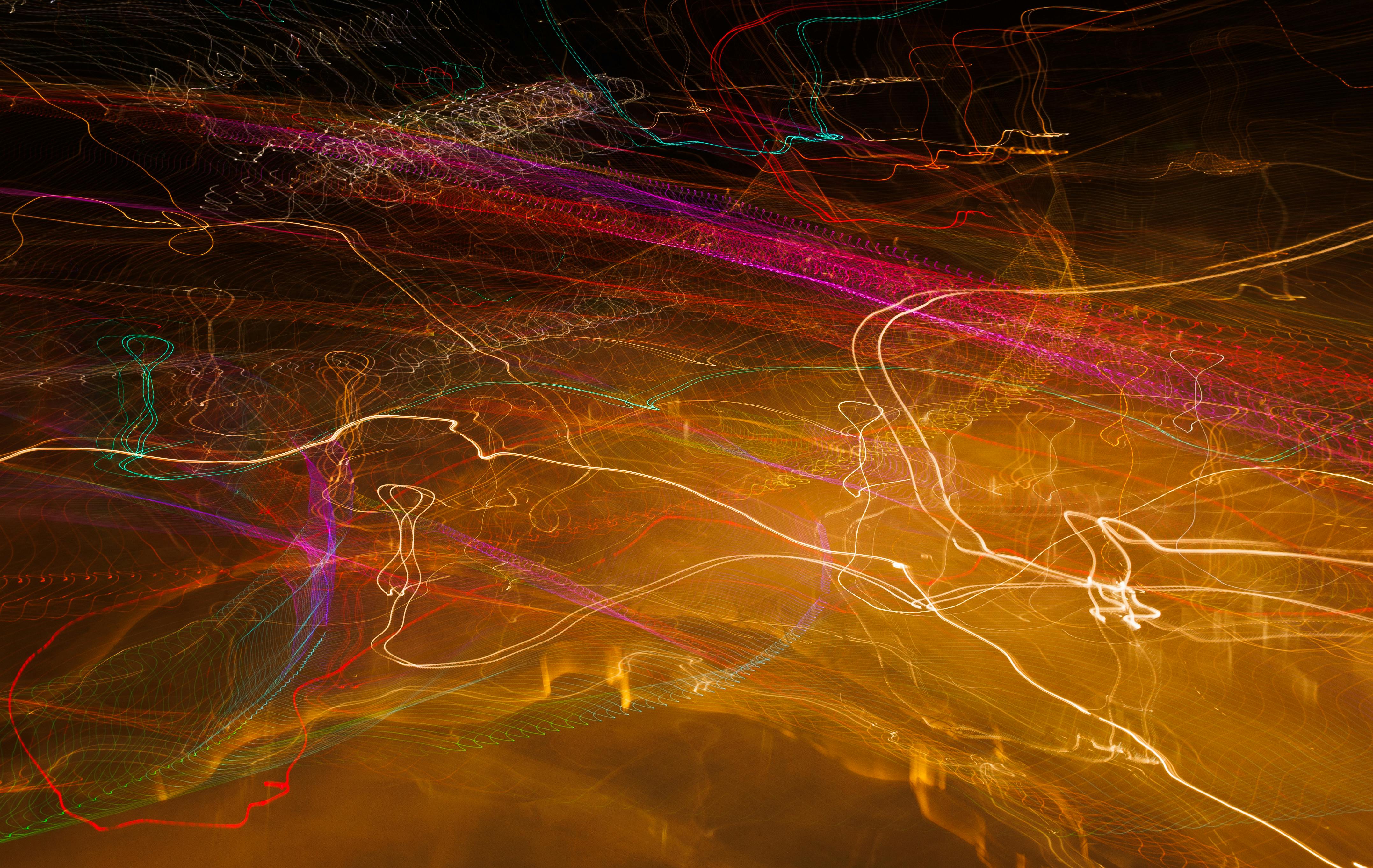 Vibrant long exposure photo capturing colorful light streaks in motion.