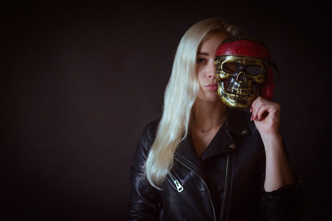 Free Photo of Woman Holding Skull Mask Stock Photo